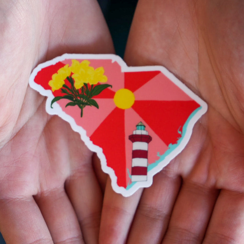 Sticker of a lighthouse and floral design held between two hands