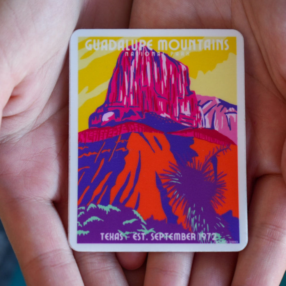 Sticker of Guadalupe Mountains National Park held between fingers