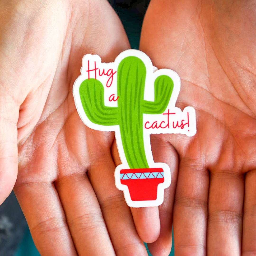 Sticker of a cactus with text held between two hands
