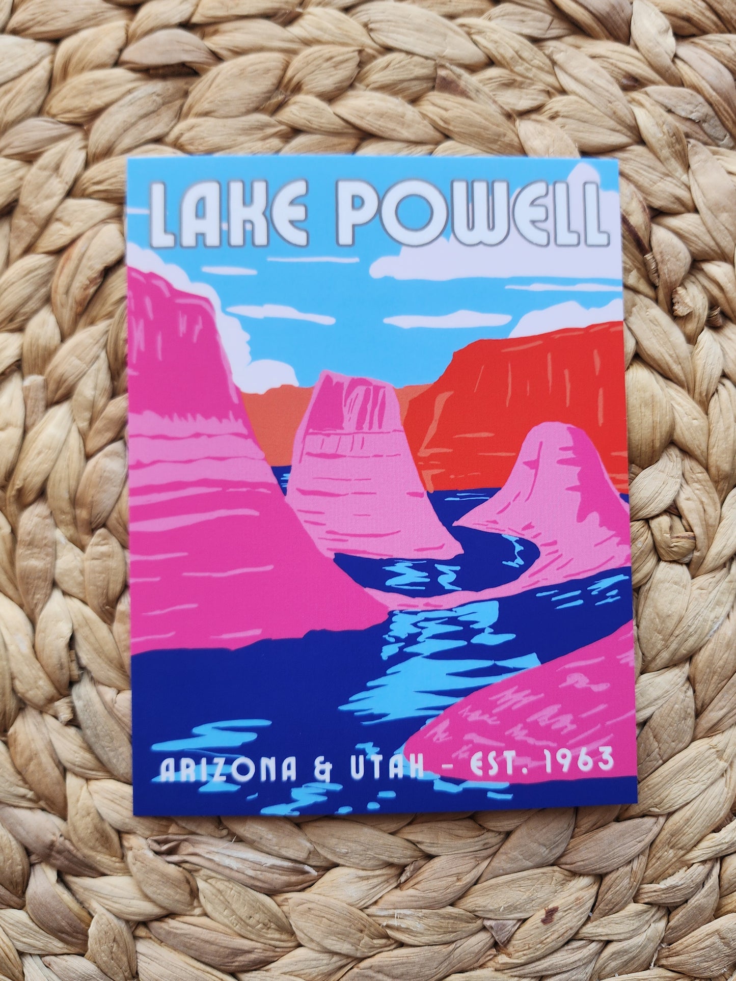 Lake Powell Postcard with red and pink mountain background and blue lake water