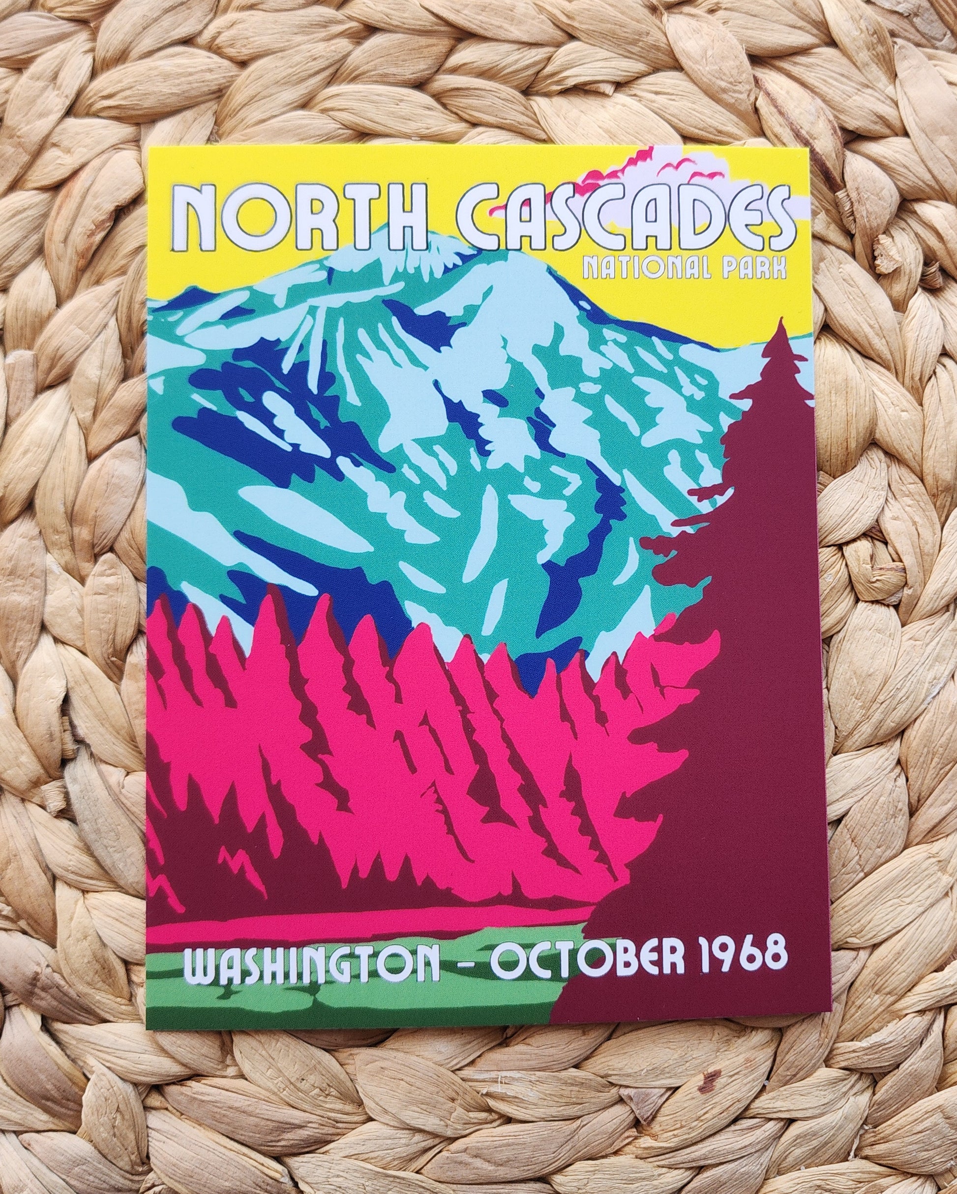 Colorful poster of the North Cascades National Park with mountain illustration on a woven surface