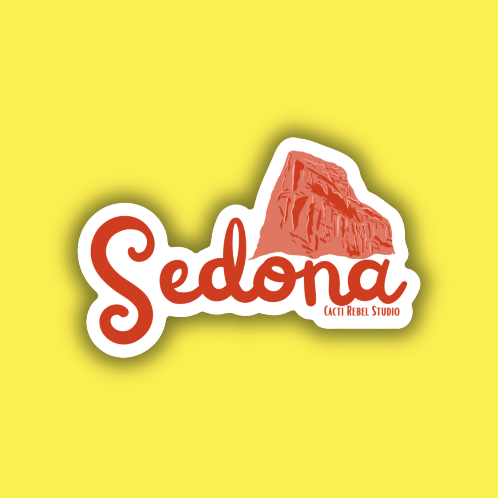 Sticker with 'Sedona' text and red rock formation on a yellow background