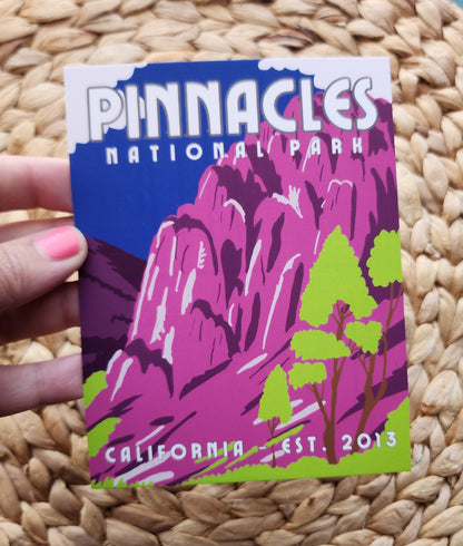 Pinnacles National Park Postcard with blue sky and white clouds behind purple mountains