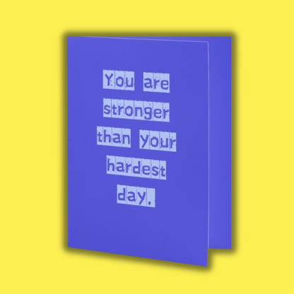 Blue card with motivational message on a yellow background