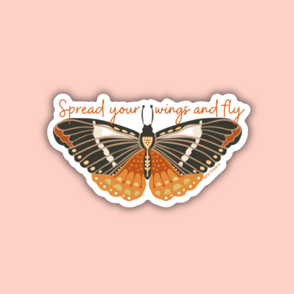 Butterfly sticker with 'Spread your wings and fly' text on a pink background